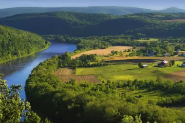 An aerial view of agricultural lands along the banks of the Susquehanna River in Bradford County, Pennsylvania.